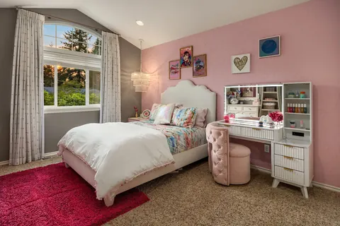 Bedroom with window seat outlook and adjoining desk area
