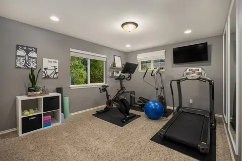 Fifth bedroom currently used as an exercise room