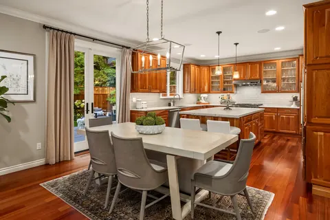 Kitchen and casual dining area with doors to the deck