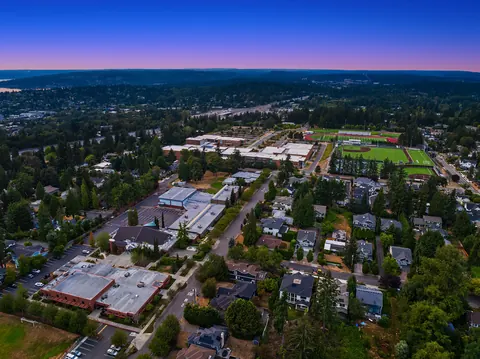 Aerial view toward nearby schools and playfields at dusk